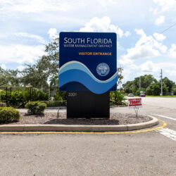 South Florida Water Management District visitor entrance blue sign.