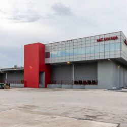 Self storage red and silver building.